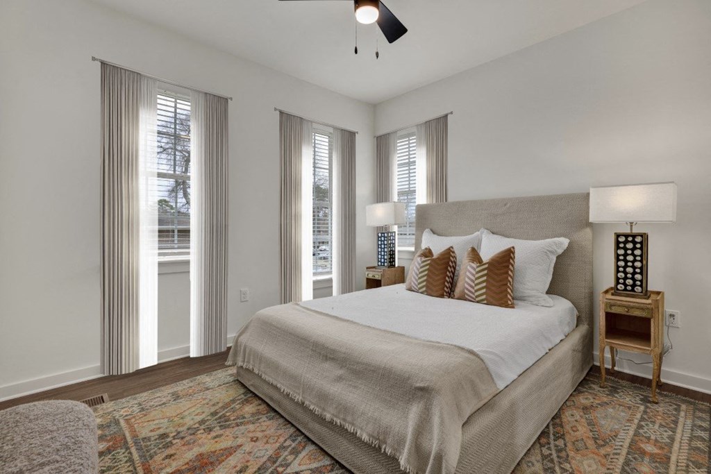 Bedroom with natural light and ceiling fan at West Row Townhomes and